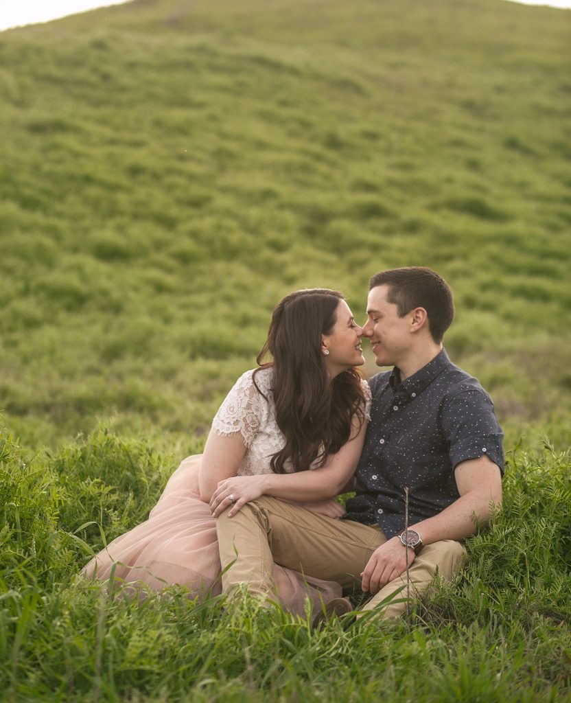 couple Kissing in Green fields at riley park