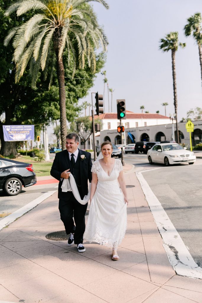 bride and groom street crossing