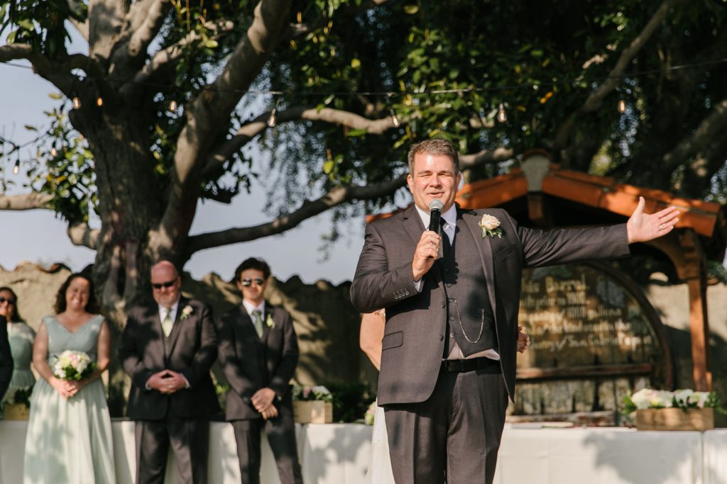 groom giving speech to crowd