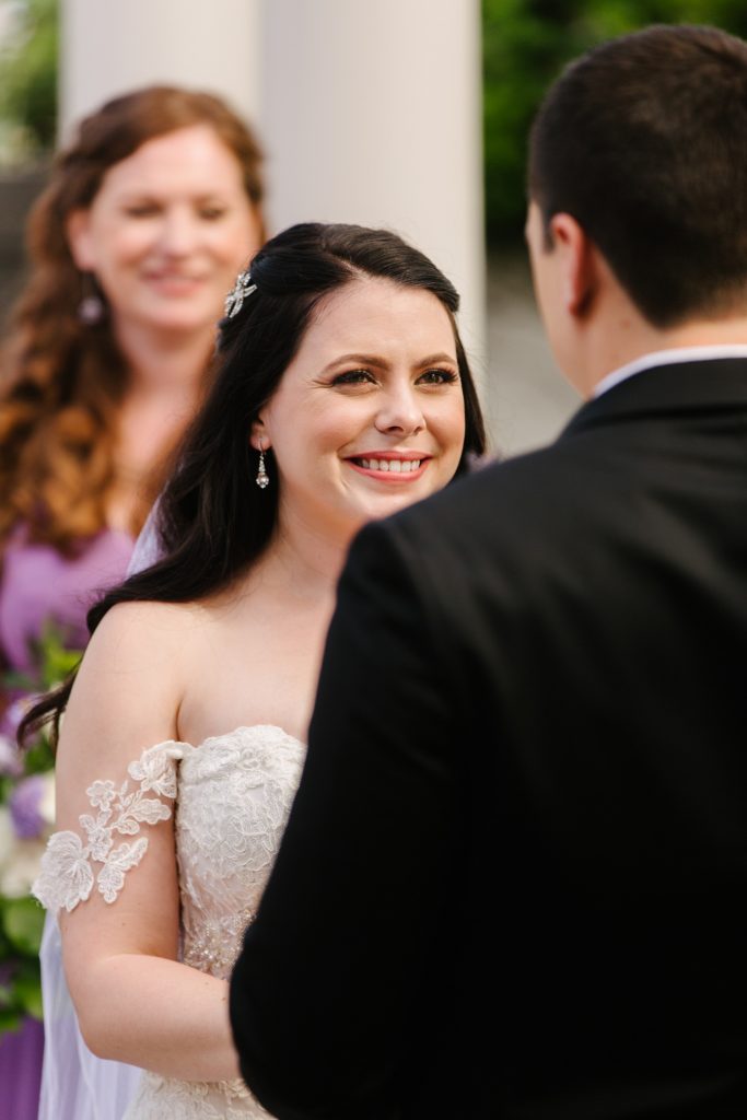 bride smiling at groom