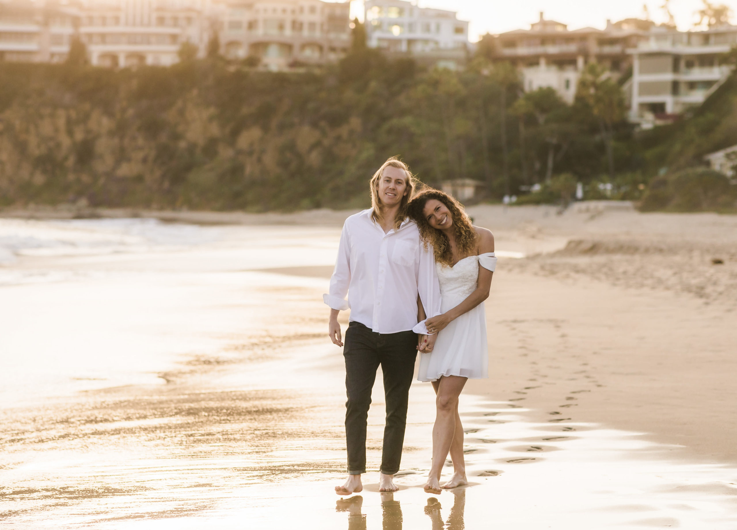 Engaged couple posing together during their Laguna Beach engagement shoot with Christopher Brown Weddings