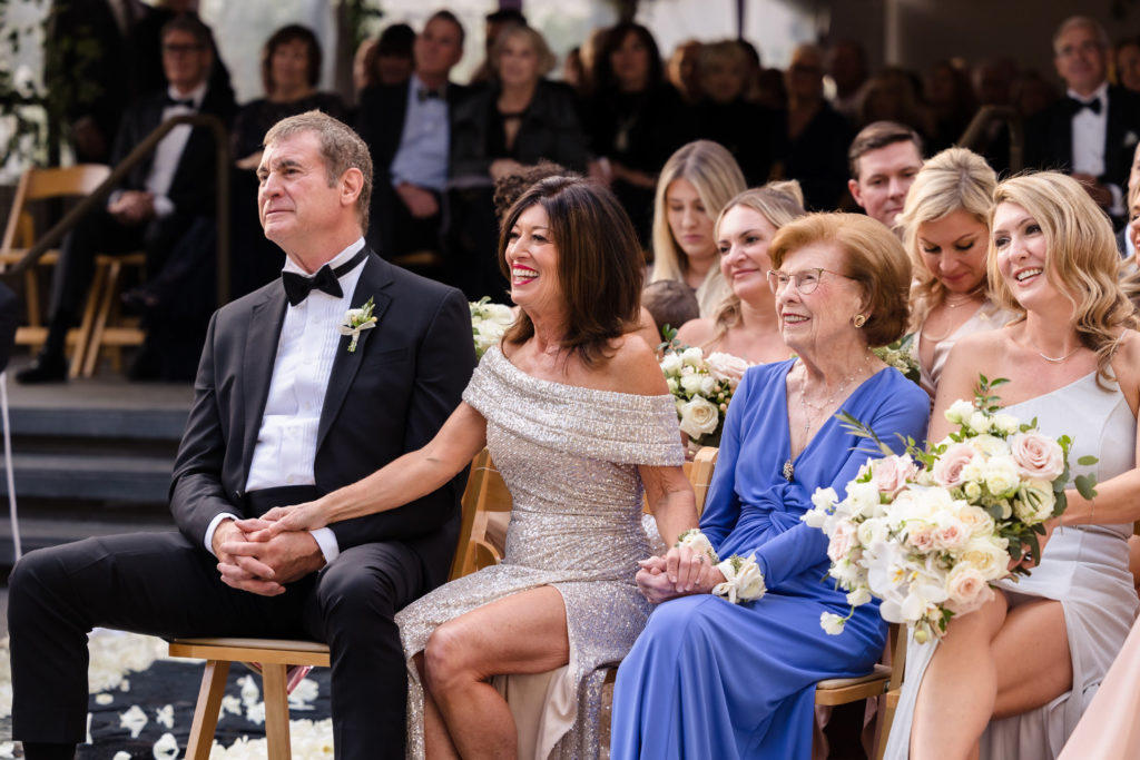 Seven Degrees Laguna Beach Wedding: Complete Planning Guide. Wedding guests sitting in their seats during the ceremony.