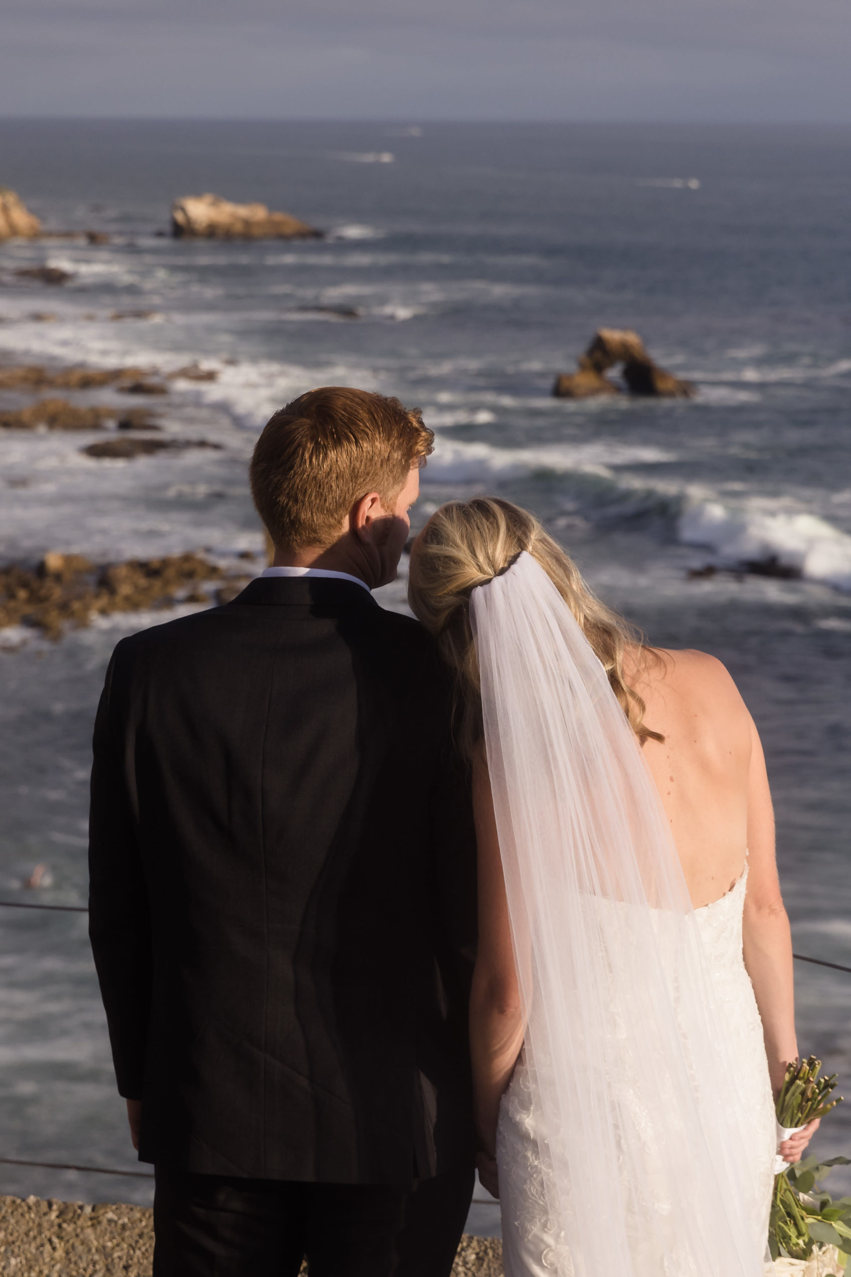 Couple looking out into the ocean view at Montage Laguna, captured by Christopher Brown Weddings