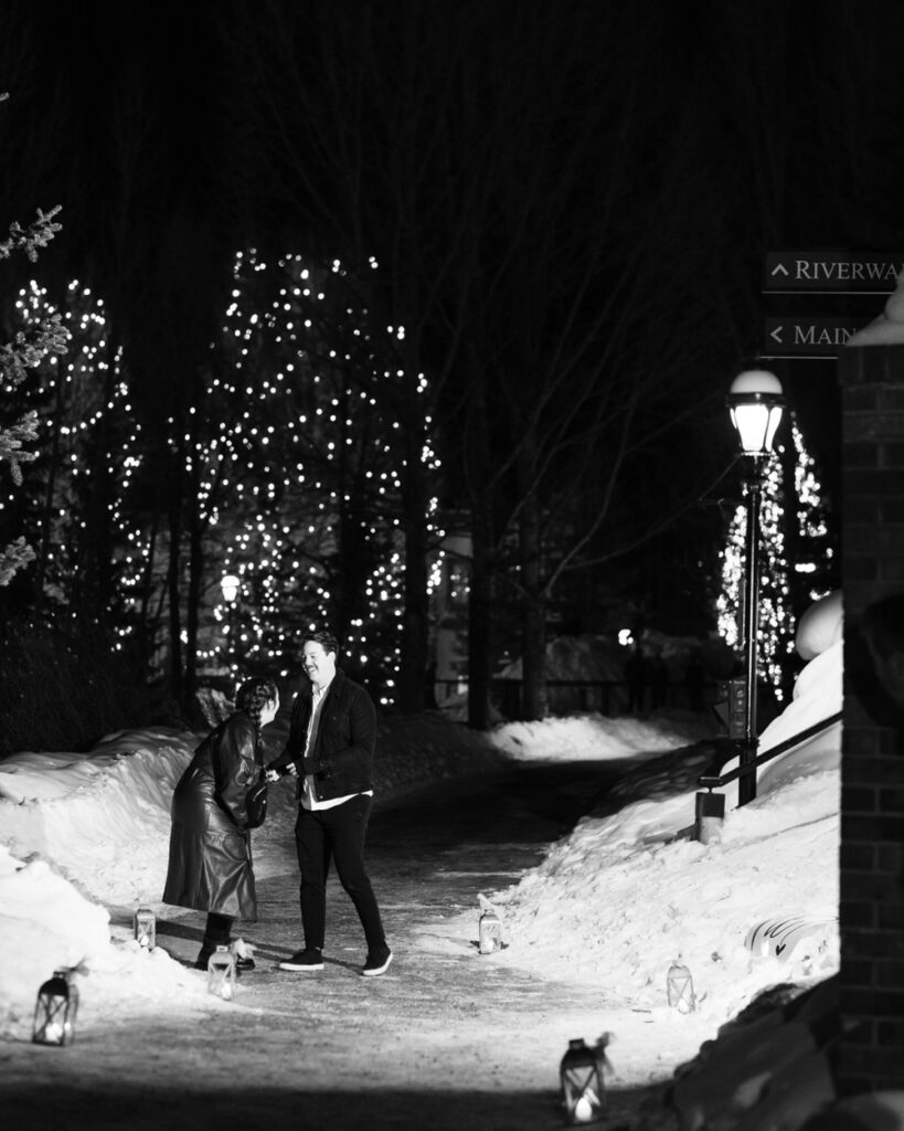 20 Of The Best Winter Wedding Venues In California. Black and white photo of couple candidly laughing with each other in the middle of a path.