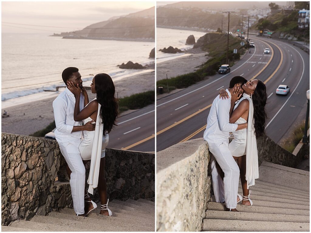 Couple embracing on the steps overlooking the Pacific Coast Highway and Will Rogers State beach at Malibu engagement session