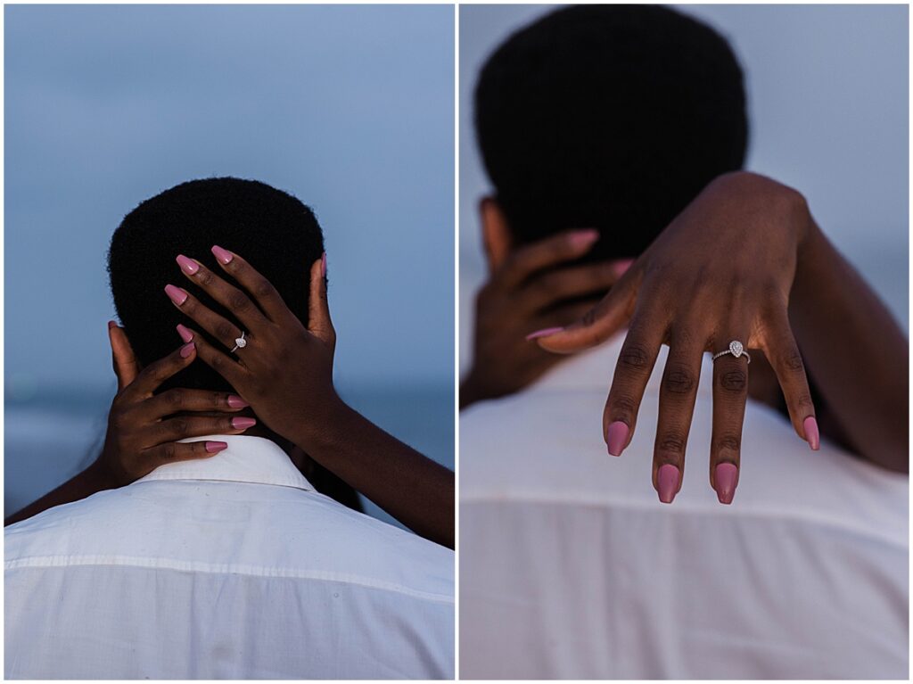 Close up of engagement ring with pink nails