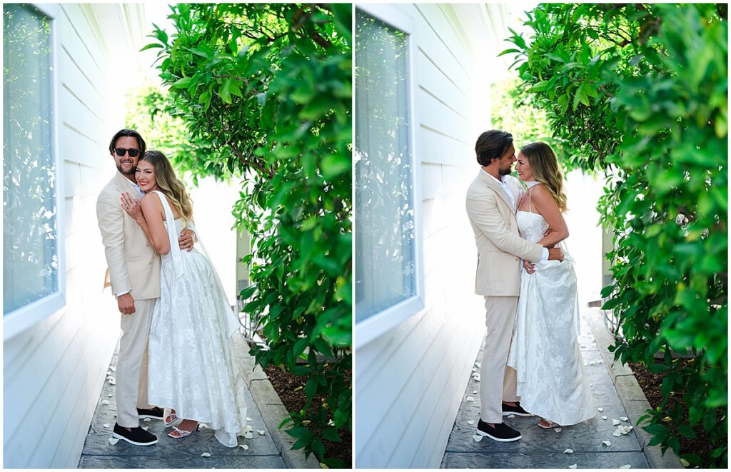 Bride and groom by greenery at backyard wedding San Diego