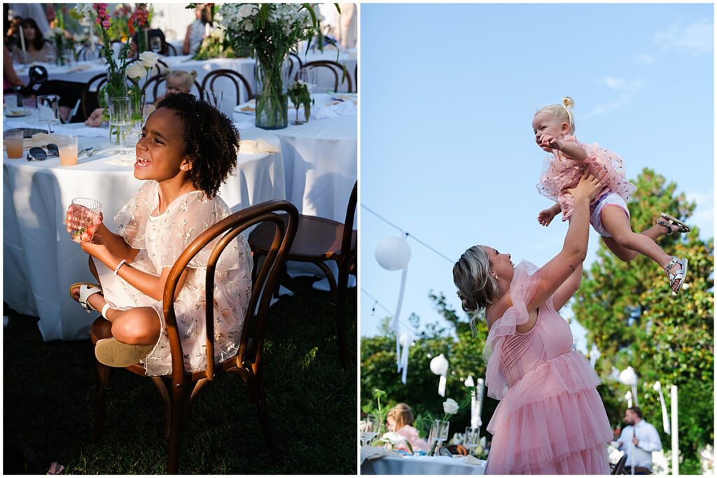 Child sitting on chair and woman raising baby into the air