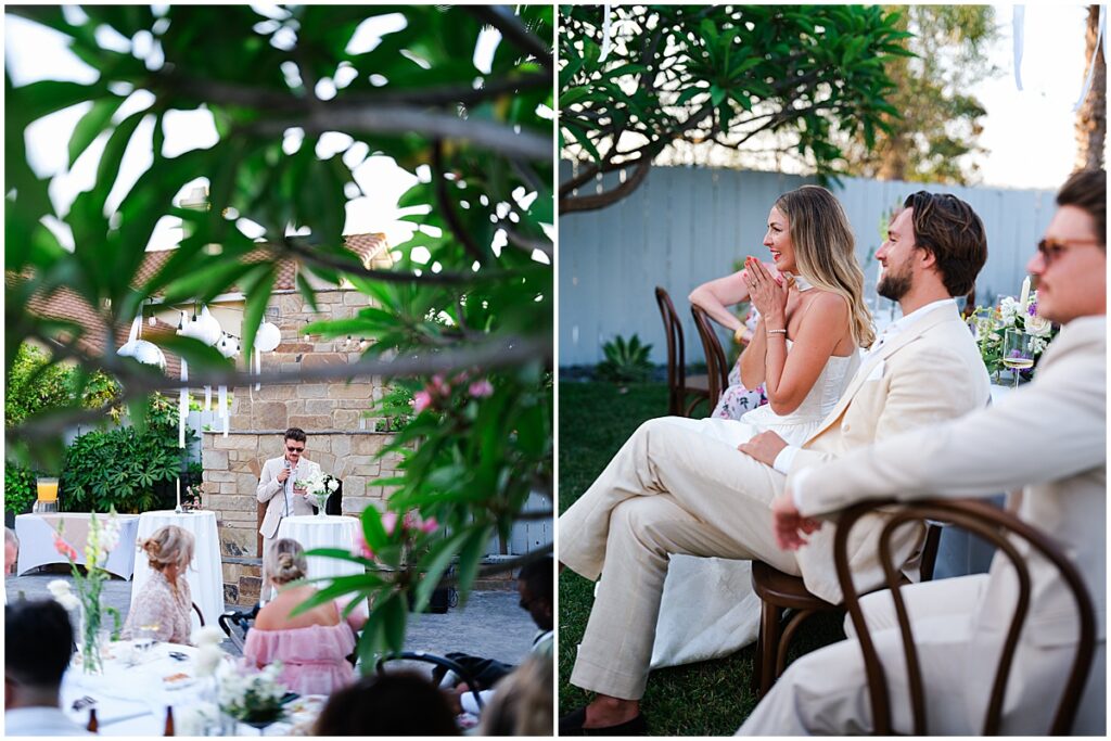 Bride and groom watching wedding speeches at backyard wedding