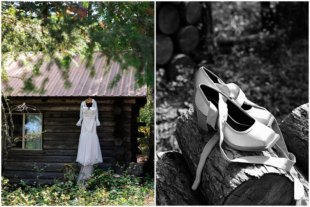 Bride's dress hanging outside a cabin and shoes sitting on a log