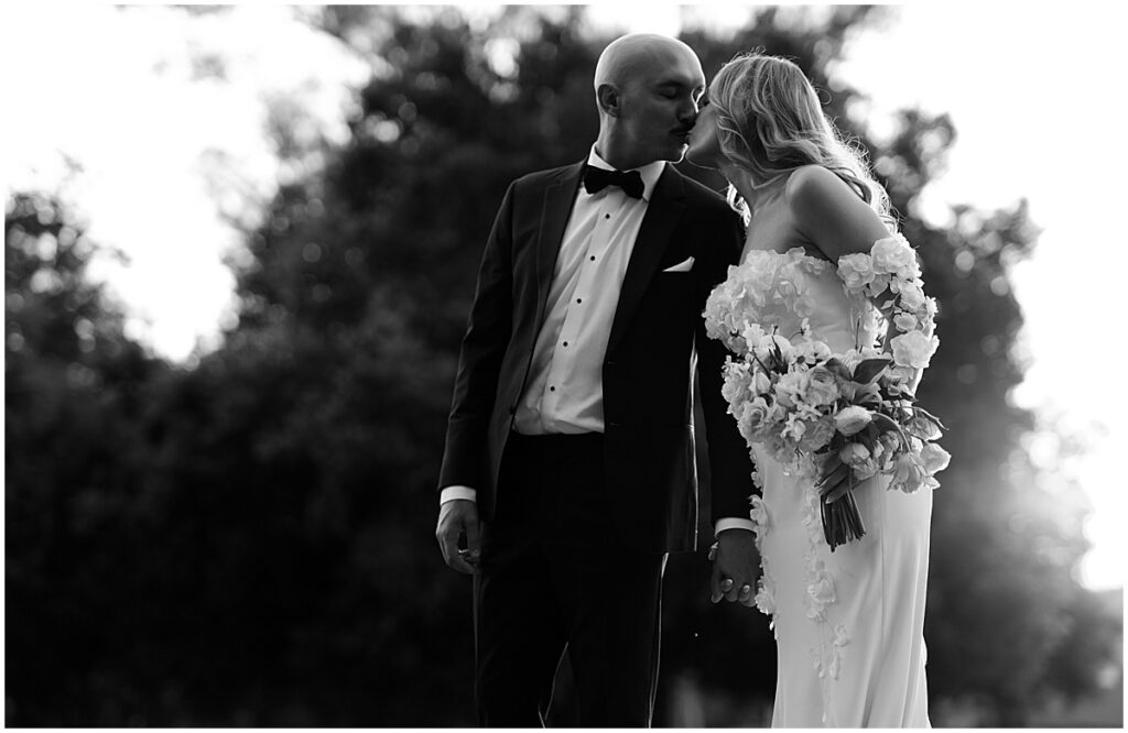 Bride and groom kissing at Muckenthaler Mansion wedding